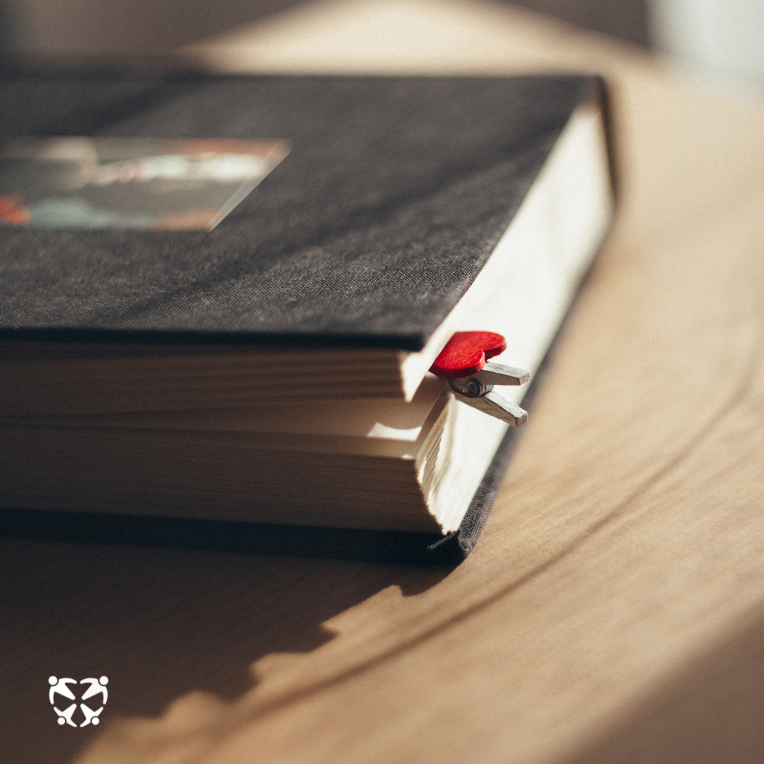 Closed book with heart bookmark